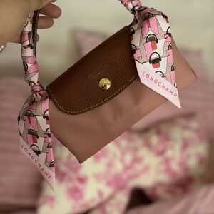 Longchamp Pink and Brown Clutch with Patterned Handle
